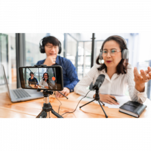 A man and woman in front of the camera and being confident on camera