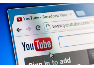 A picture of the top left hand corner of the YouTube site, where you can search for videos that business have created